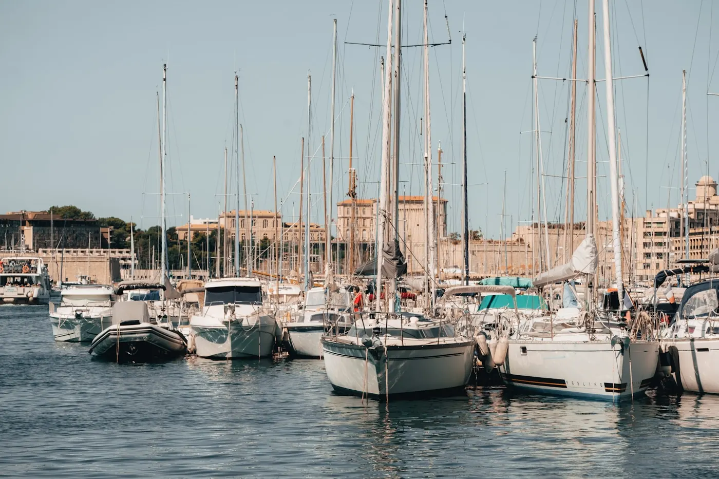 Marina harbour lined with moored sailing boats